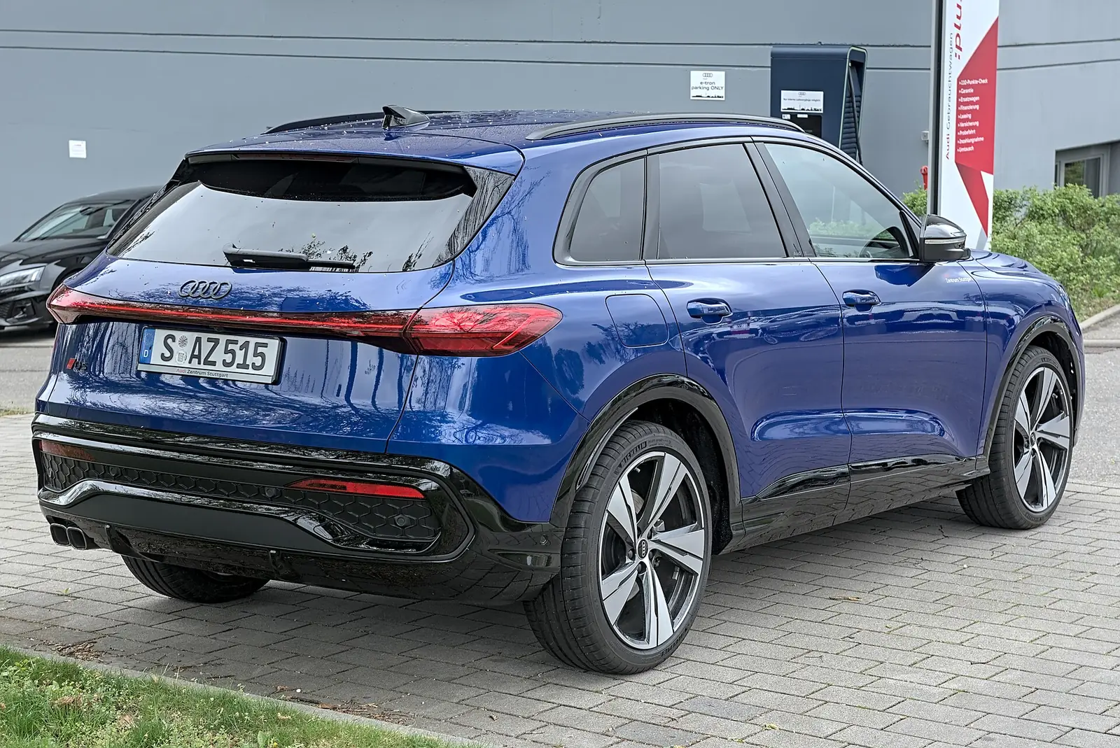 Blue Audi Q5 SUV, rear three-quarter view, a midsize luxury SUV often leased in Pacific Palisades