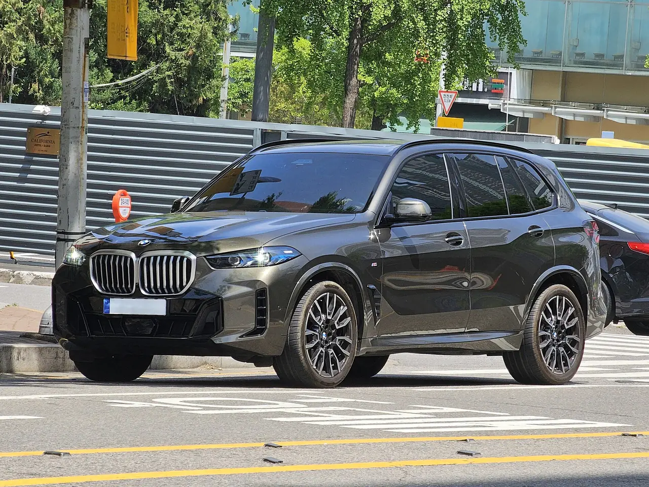 Dark gray BMW X5 SUV with M Sport styling, the kind of luxury SUV Brentwood families often lease