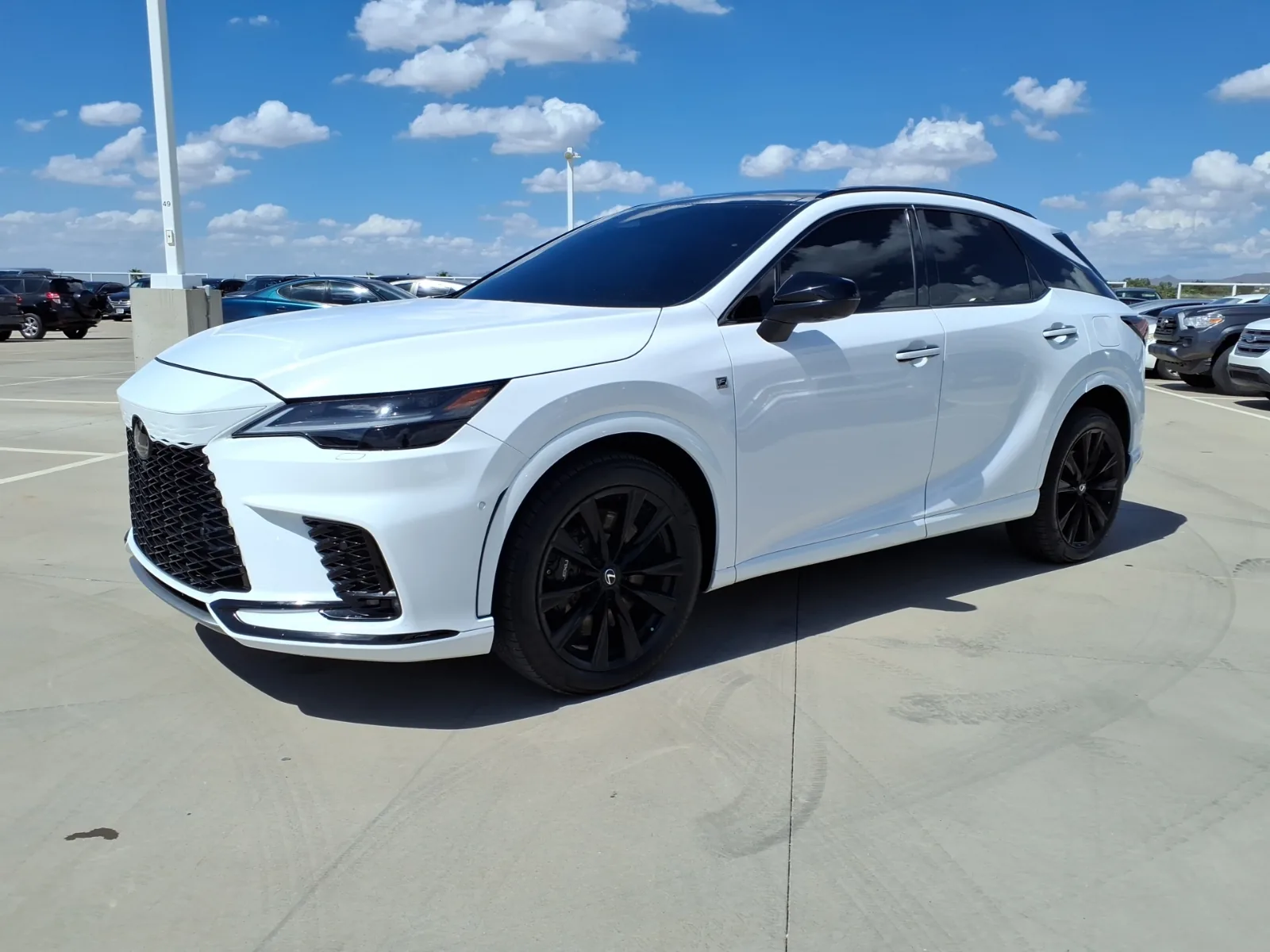 White Lexus RX 500h F Sport Performance hybrid SUV, a popular lease choice on the Westside