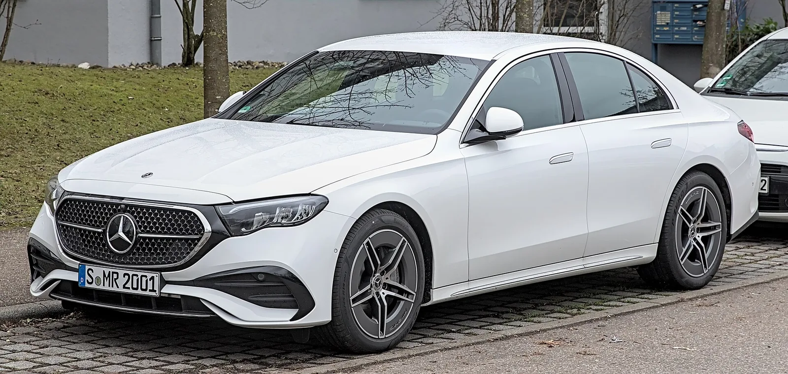 White Mercedes-Benz E-Class sedan, side view, a common lease for Valley commuters