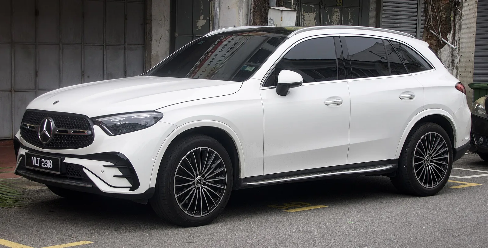 White Mercedes-Benz GLC 300 4MATIC compact luxury SUV, a common lease on Santa Monica's Wilshire corridor