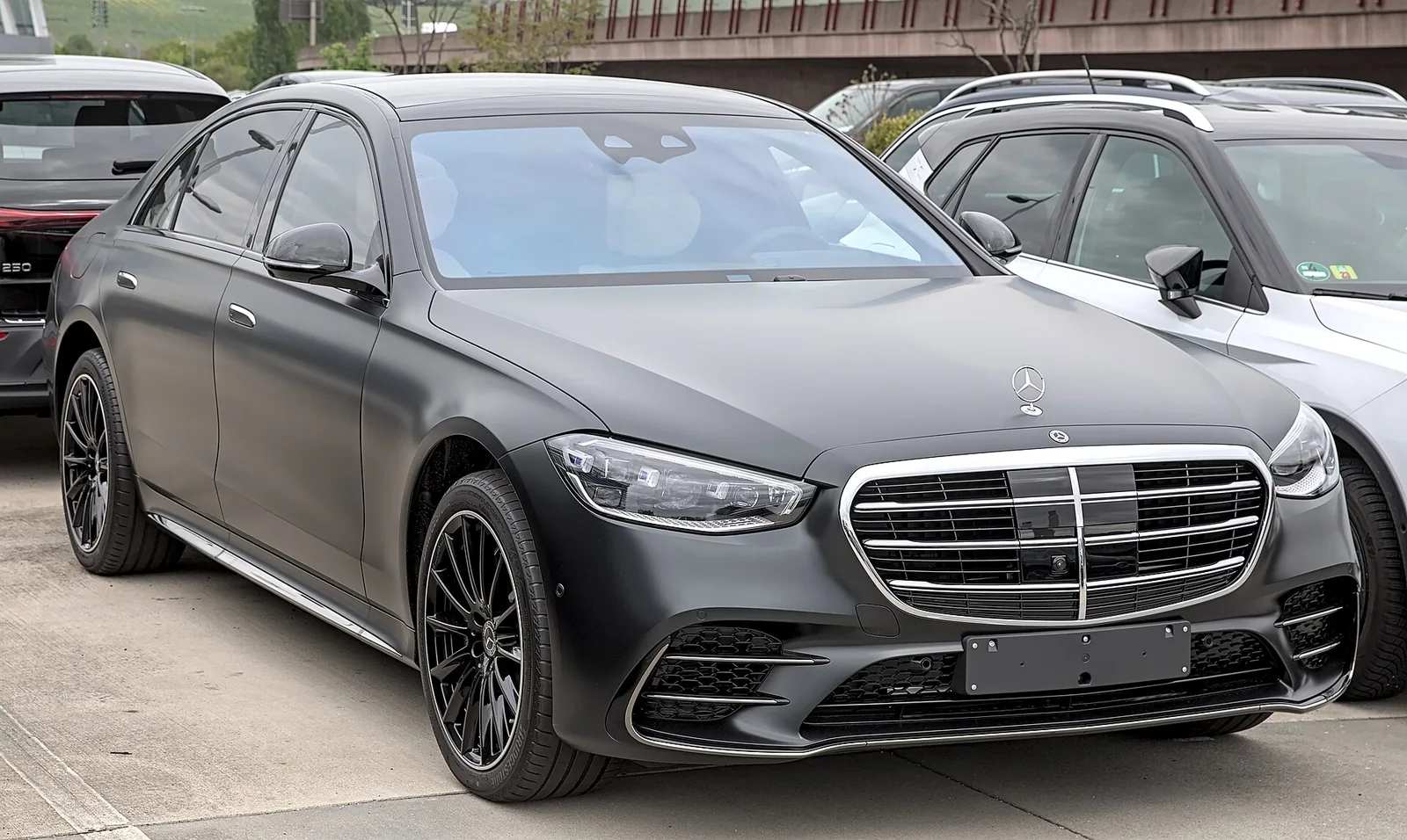 Dark gray Mercedes-Benz S-Class luxury sedan, front three-quarter view